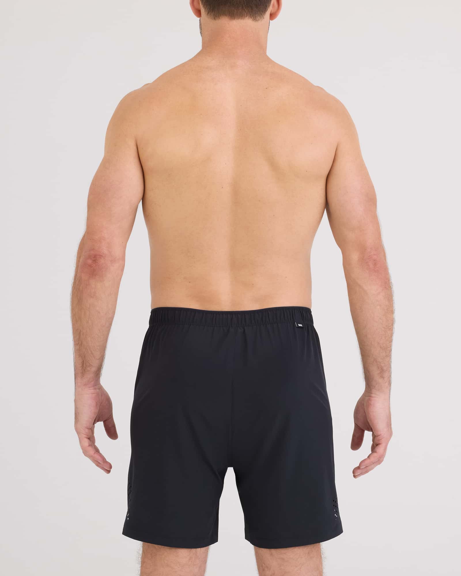 Back - Model wearing Power Moves 2N1 Short 7" in Black