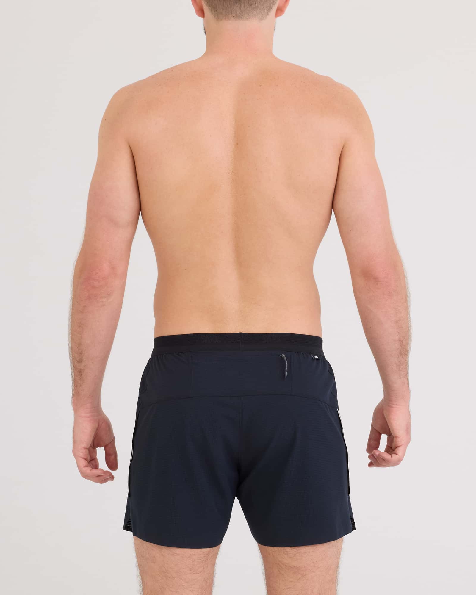 Back - Model wearing Race Pace 2N1 Run Short 5" in Black