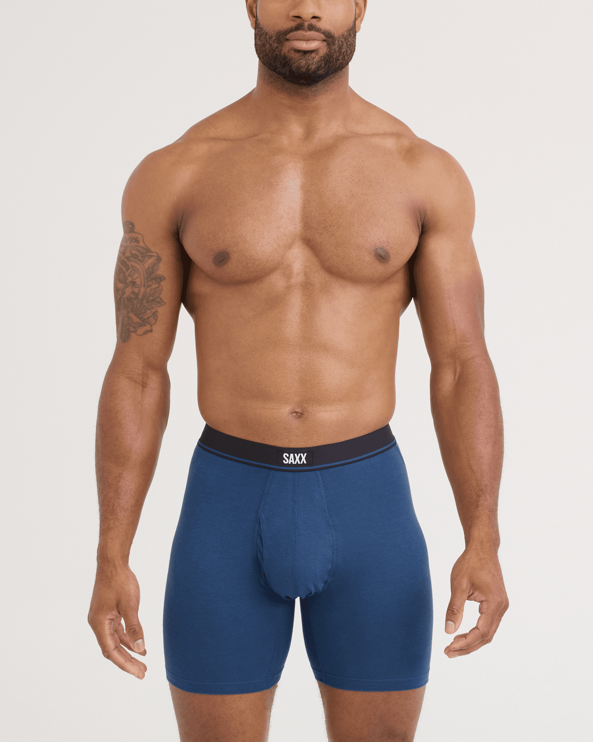 Front - Model wearing Essential Cotton Boxer Brief in Dark Denim
