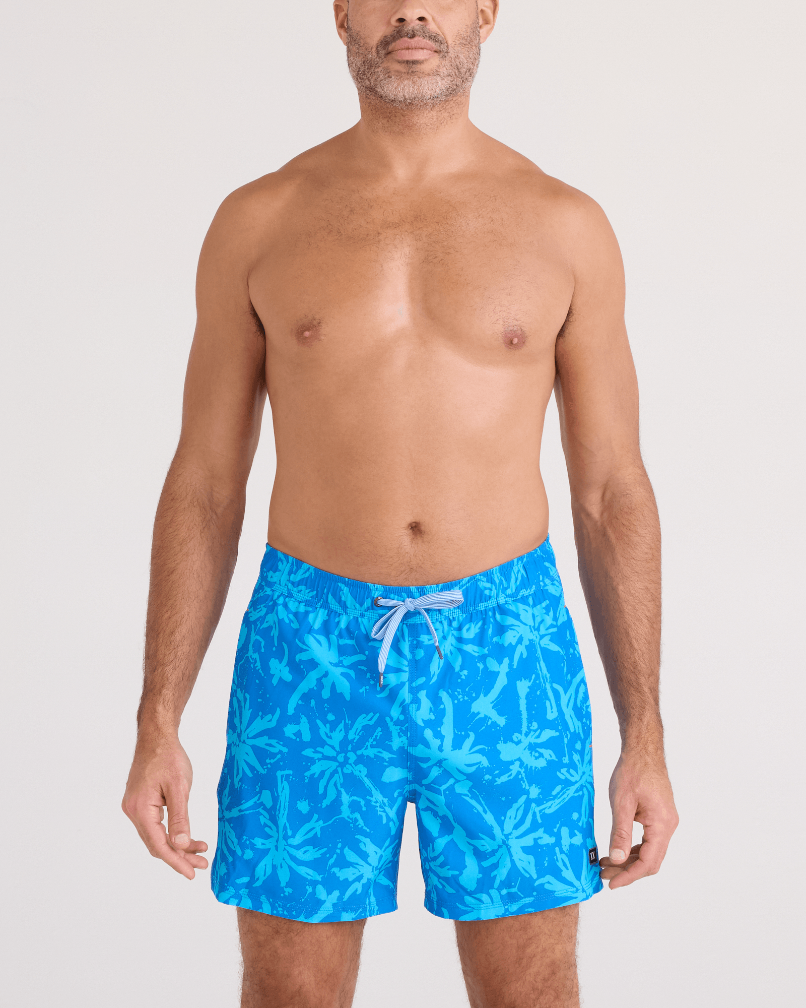 Front - Model wearing Oh Buoy 2N1 Swim Trunk 5" in Splash Palms-Bold Blue