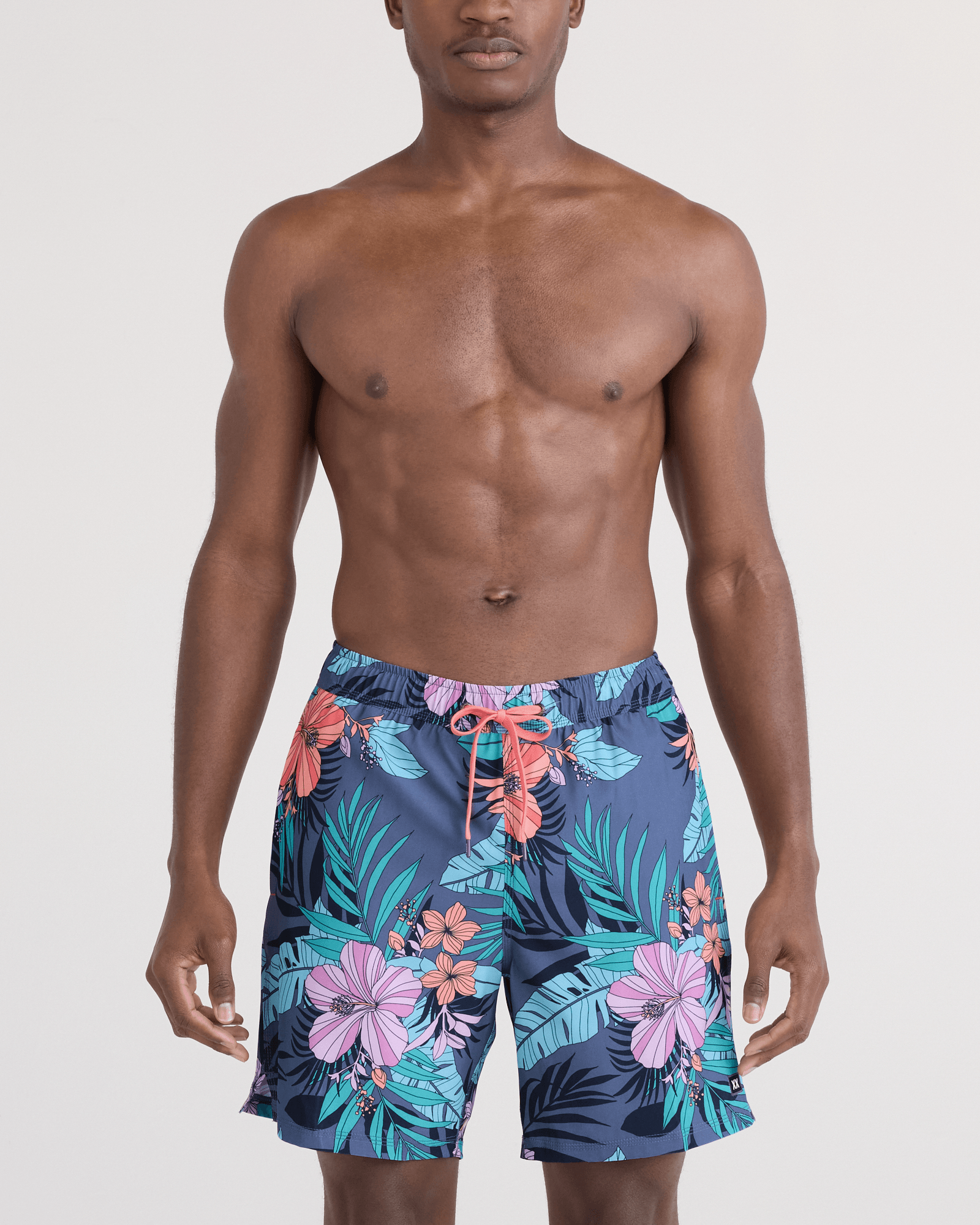 Front - Model wearing Oh Buoy 2N1 Swim Trunk 7" in Hibiscus Jungle-Indigo