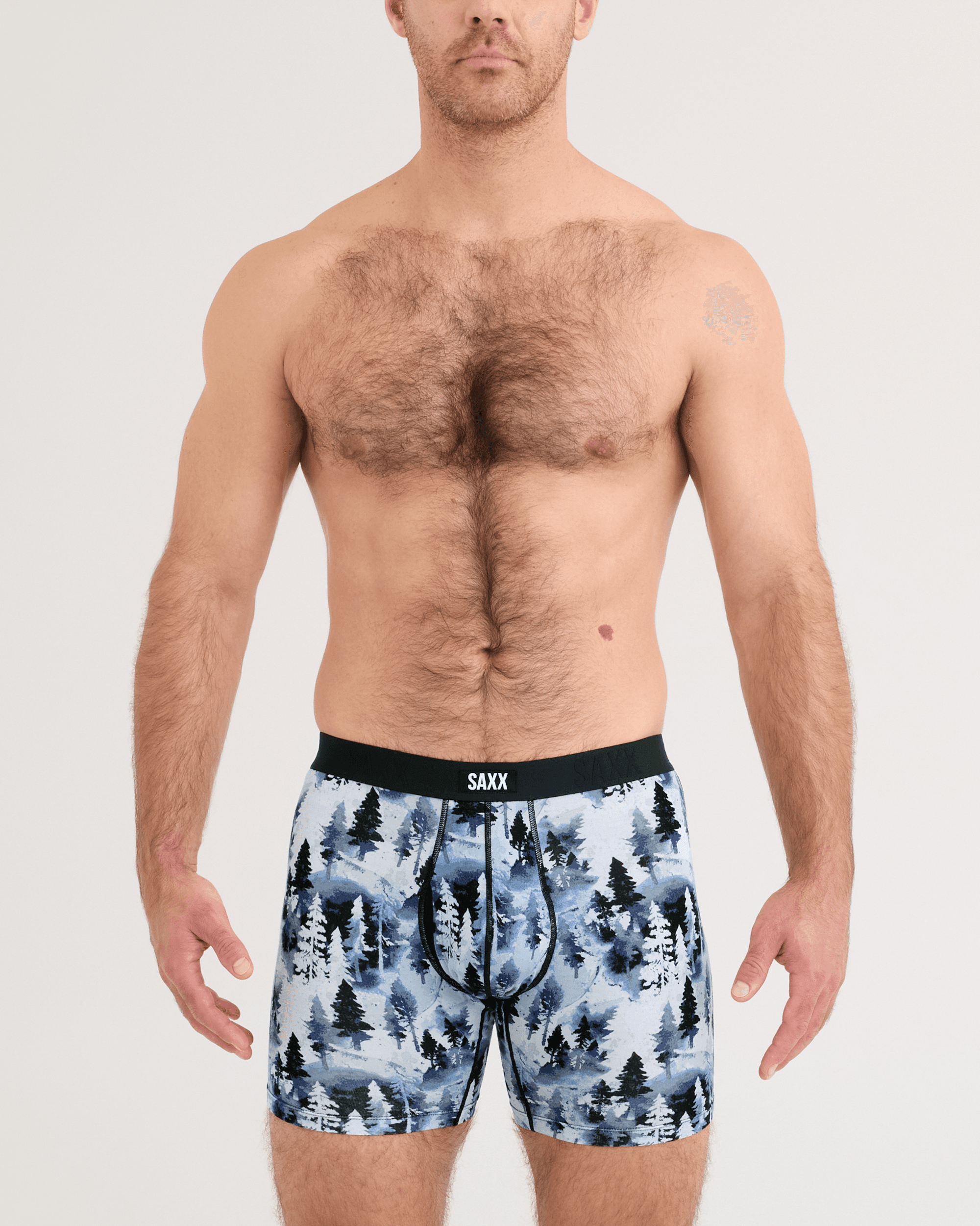 Front - Model wearing Vibe Xtra Soft Comfort Boxer Brief in Forestland-Midnight Blue