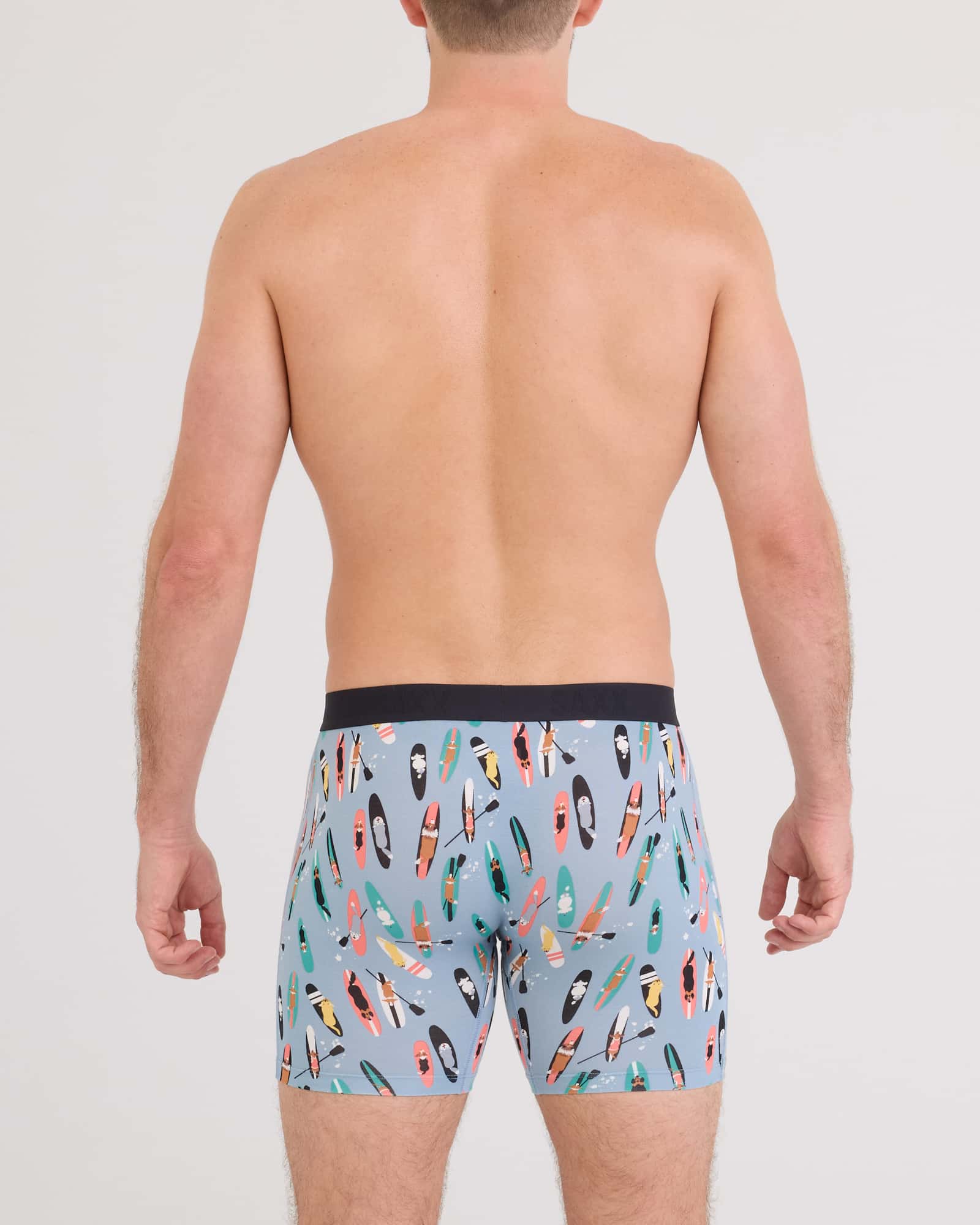 Back - Model wearing Vibe Xtra Boxer Brief in Sup Dogs-Ashley Blue