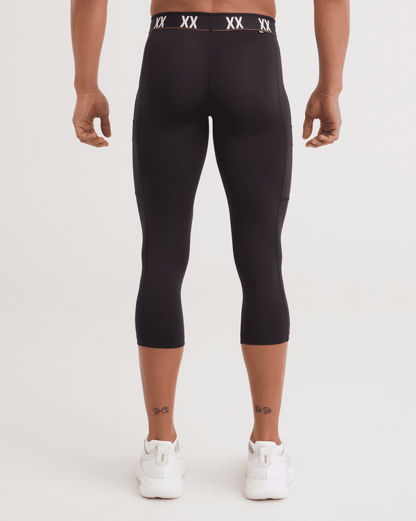 Back - Model wearing Multi-Sport Mesh Tights in Black