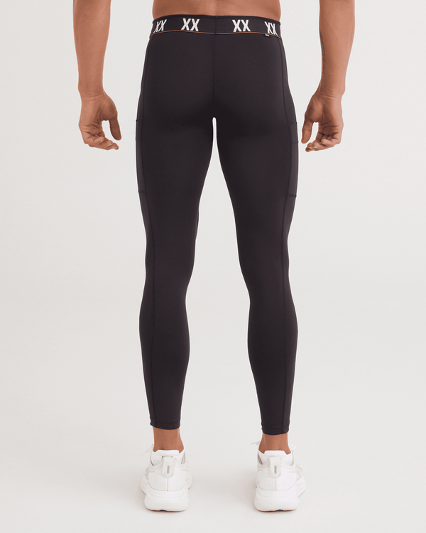 Back - Model wearing Multi-Sport Mesh Tights in Black
