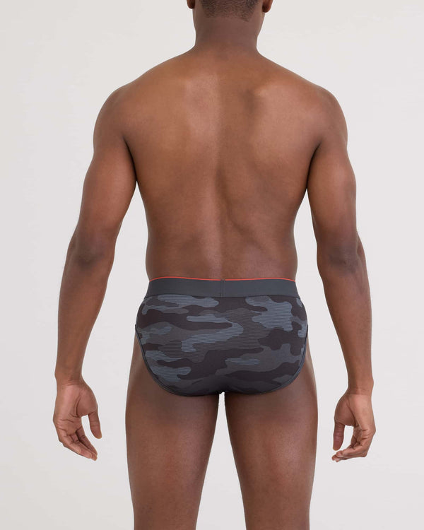 Back - Model wearing Multi-Sport Mesh Brief in Remote Camo - Faded Black