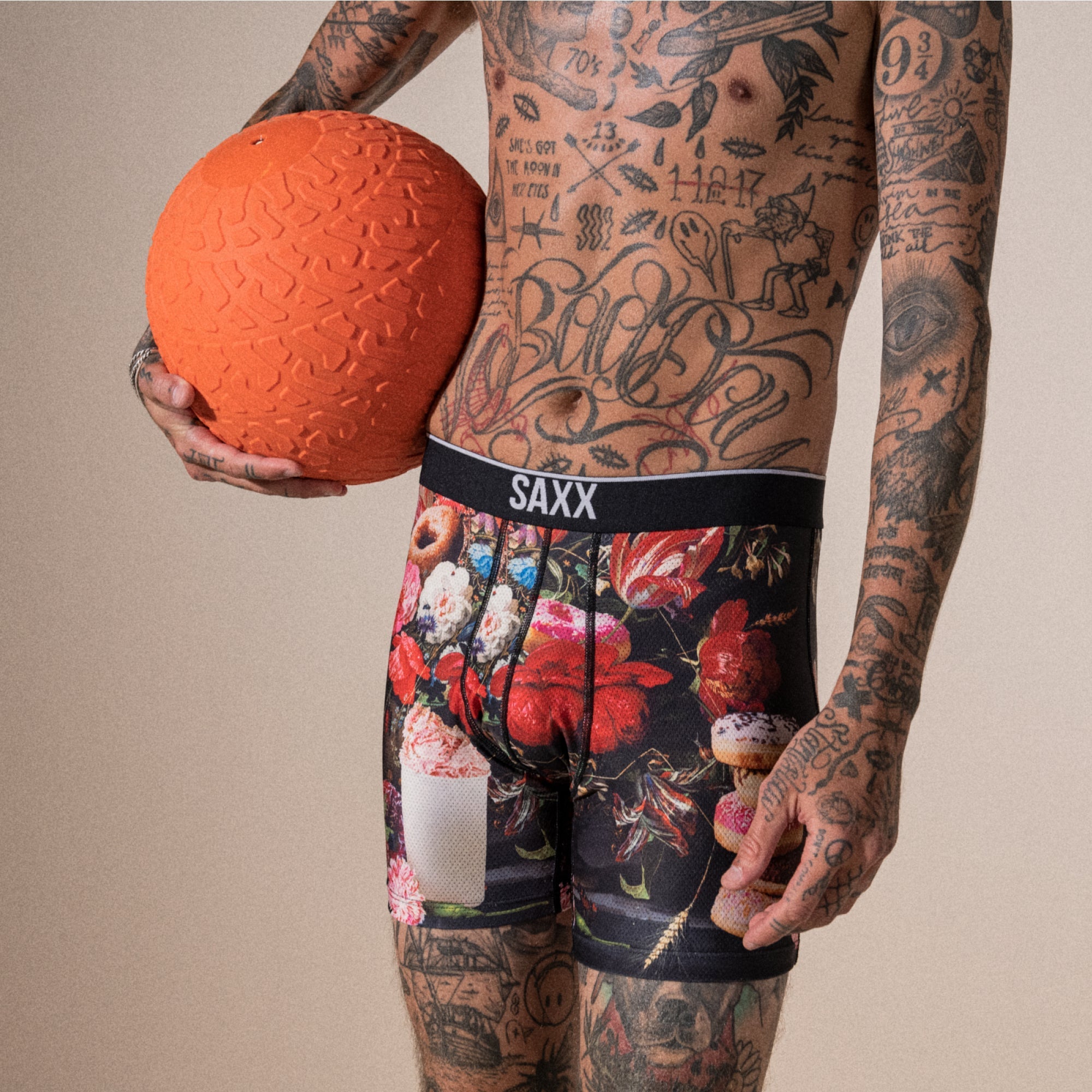 Model posing in Volt Breathable Mesh Boxer Brief in Renaissance Donut- Multi