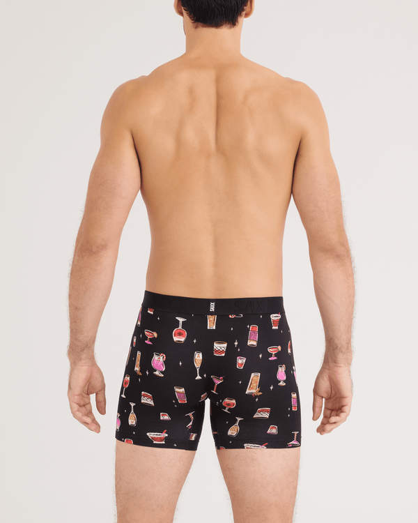 Back - Model wearing DropTemp Cooling Cotton Boxer Brief 2 Pack in Jingle Juice/Jingle Stripe