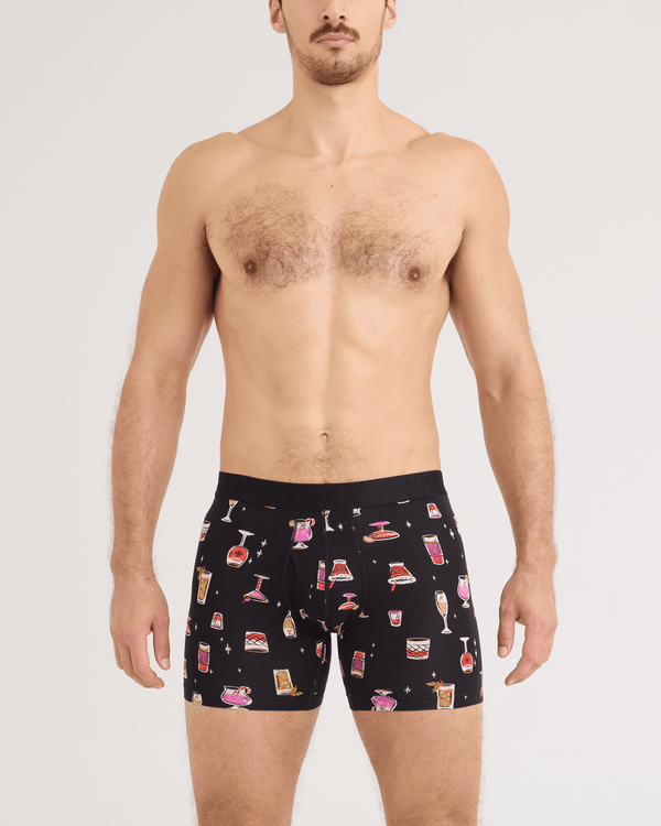 Front - Model wearing DropTemp Cooling Cotton Boxer Brief 2 Pack in Jingle Juice/Jingle Stripe